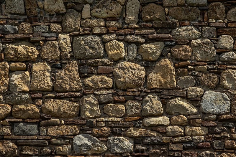 Old medieval stone and brick wall background