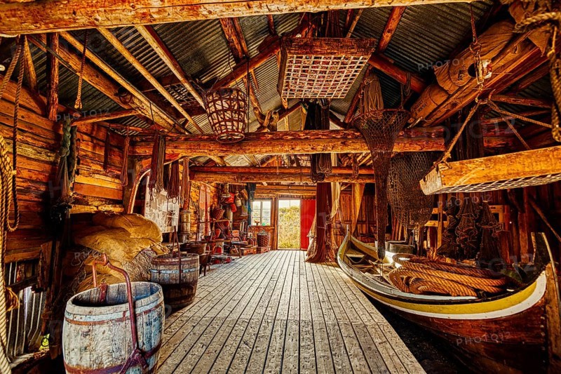 A wooden interior features tightly packed fishing equipment and a small boat, suggesting a seashore setting, mountains, rocks, road, sea, ocean, water, nature, couds, vilage, Lofoten Islands, Norway, Norge, Europe
