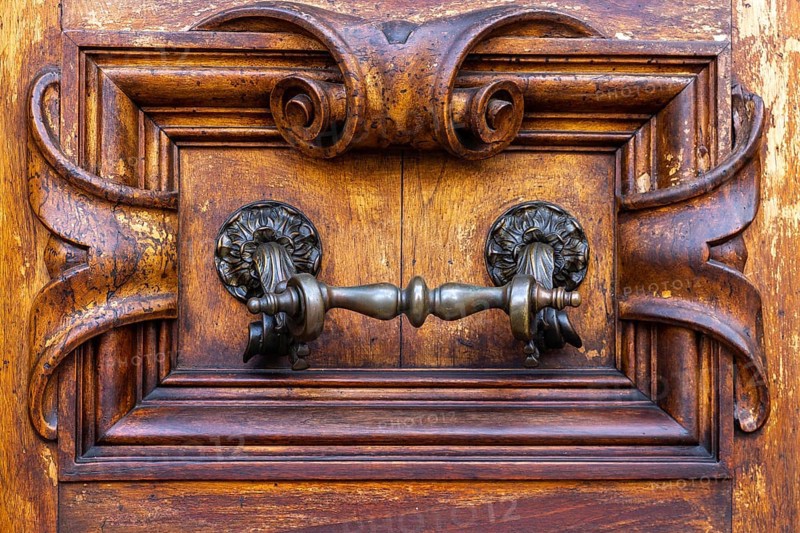 Close up of rustic old door in Florence, Italy, Europe