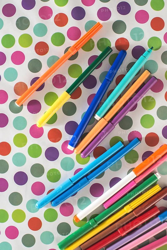 Pens on colorful circles background
