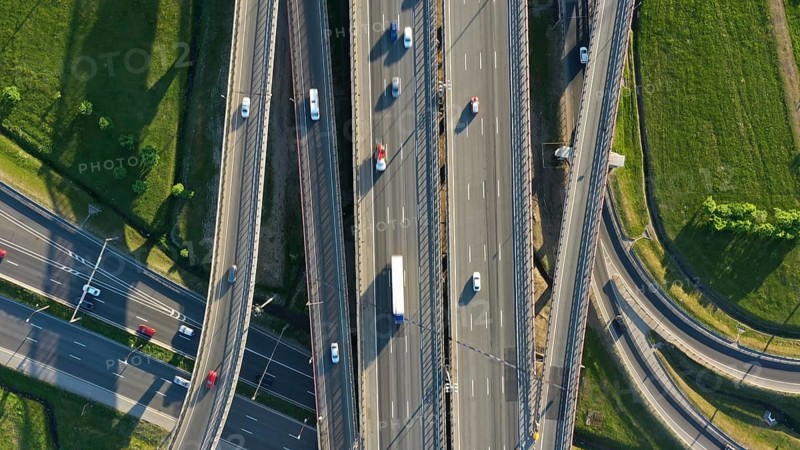 Aerial top view of lot of cars on modern road junction