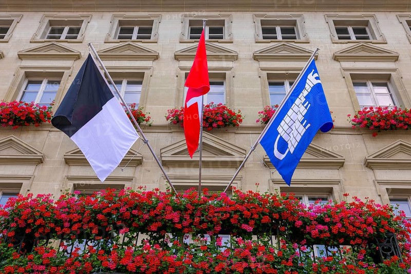 City Hall with Flag and Flowers in a Sunny Summer Day in City of Fribourg, Canton Fribourg, Switzerland, Europe