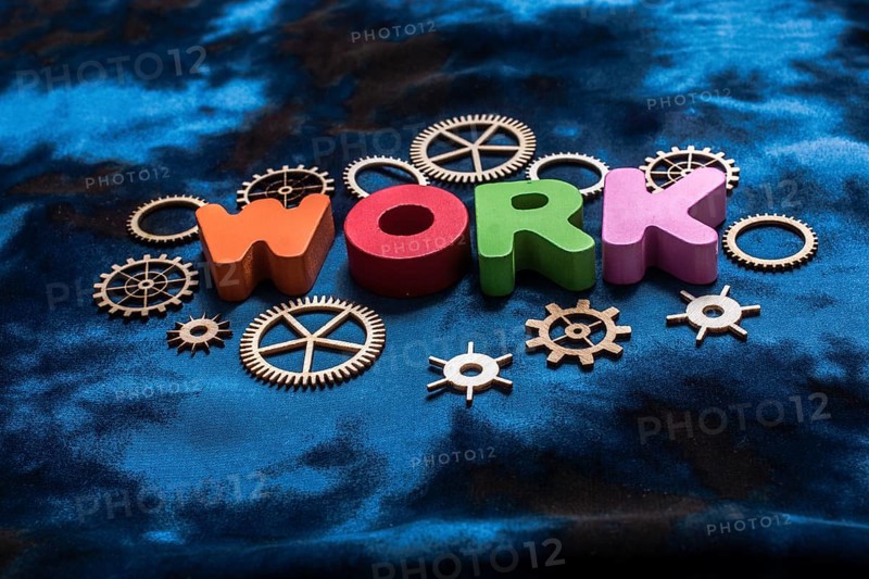 Work wording and wooden cogwheels as industry mechanism concept