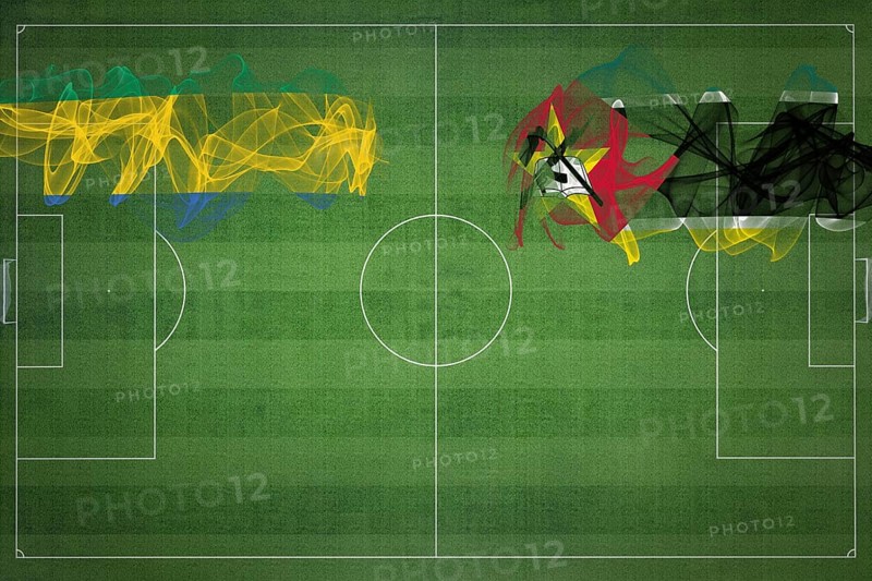 Gabon vs Mozambique Soccer Match, national colors, national flags, soccer field, football game, Competition concept, Copy space