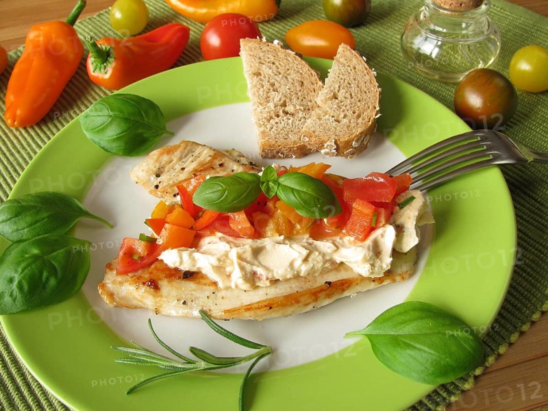 Cream cheese and tomato and pepper salsa on turkey escalope