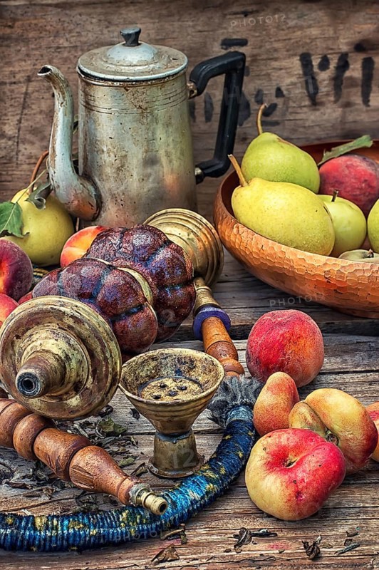 Details were worked hookah on the table amid fresh peaches.Photo tinted.Selective focus