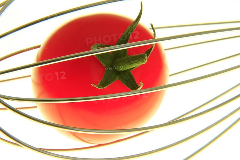 Cocktail tomato in a whisk