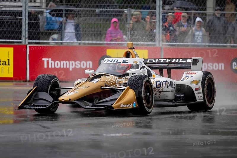 INDYCAR Series driver, RINUS VEEKAY (21) of Hoofddorp, Netherlands, travels through the turns during a wet and dangerous practice session for the Big Machine Music City Grand Prix at Streets of Nashville in Nashville TN
