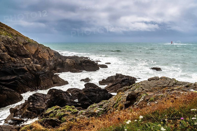 Scenic view of cliffs and sea against cloudy sky. Pointe Saint Mathieu, Brittany, France, Europe