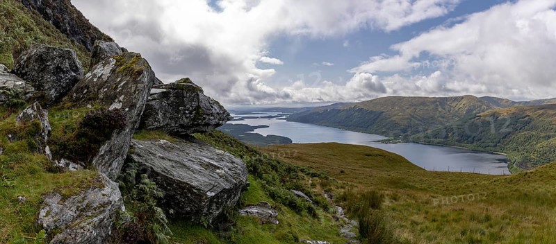 Rocks at the summit and views of Loch Lomond and the Loch Lomond and the Trossachs National Park area, Ben Lomond, Rowardennan, Scotland, United Kingdom, Europe