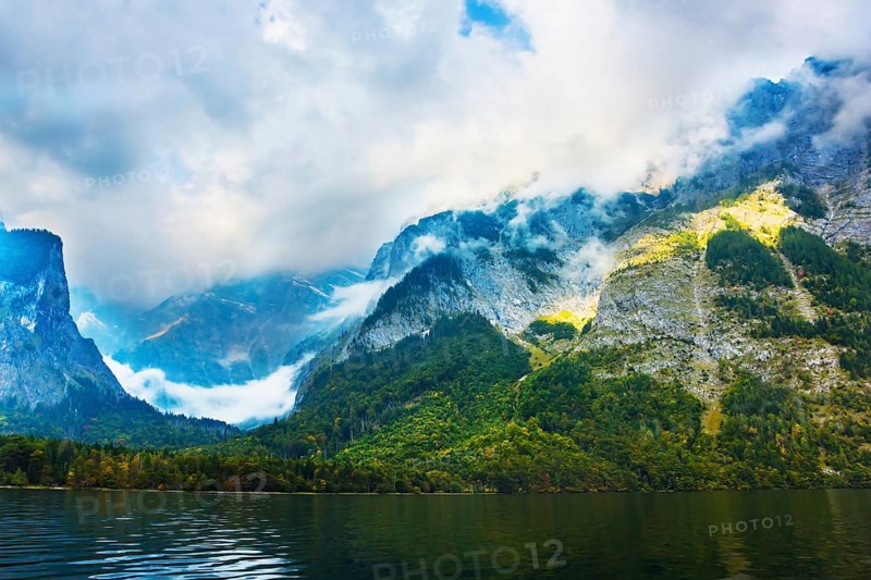 Koenigssee - the cleanest lake in Germany. The lake is surrounded by high mountains. Mountain Lake is a fabulous beauty in Bavaria. The concept of active, ecological and photo tourism