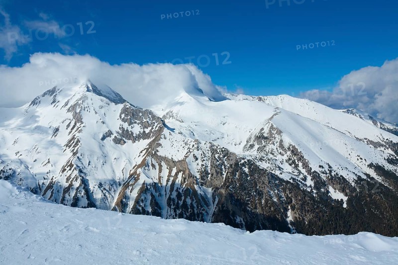 Tops of Pirin mountains view from top of cable car, ski resort Bansko, Bulgaria.
