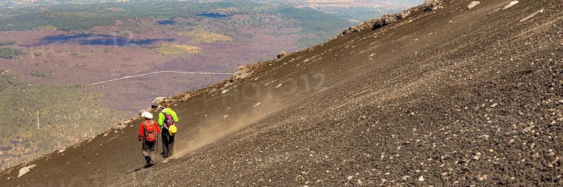 Mount Etna in Italy, Sicily. Climb Etna volcano to the top. Europe. Banner web with copy space