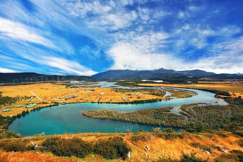 Glen Serrano. Meandering river bed of yellow autumn coast