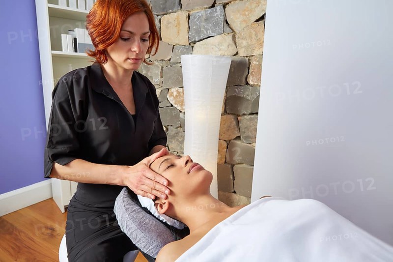 Head neck and facial massage woman with physiotherapist indoor