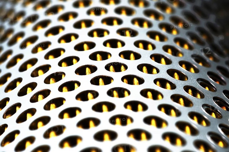 Detail of a tractor oil filter creates an industrial textured background