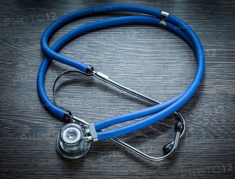 Stethoscope on vintage wooden board horizontal image