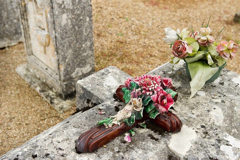Very old stone graves with moss at the cemetery