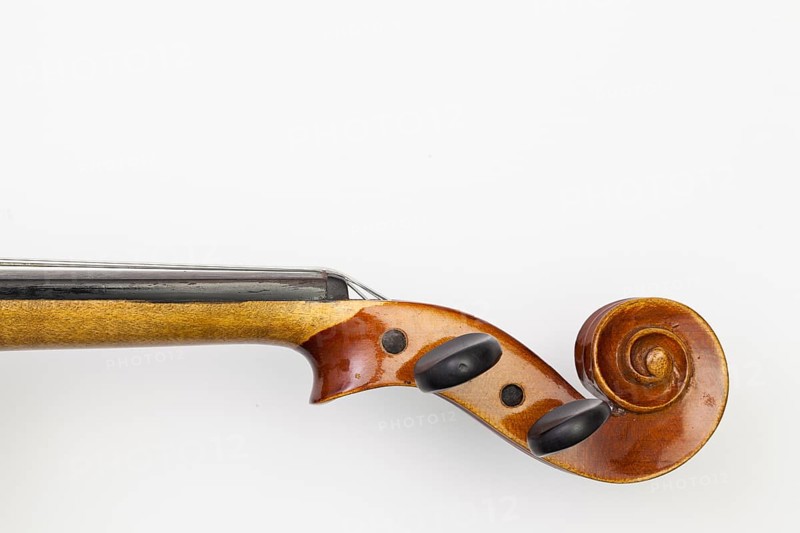 Top view close up shot of old violin on the white table. Flat Lay Image