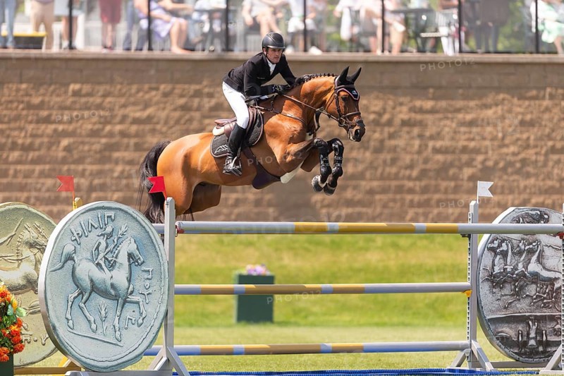 Darragh Kenney of Ireland and riding Eddy Blue, compete in the 1.60m Grand Prix during The Continental international competition at Spruce Meadows, in Calgary, Canada, North America