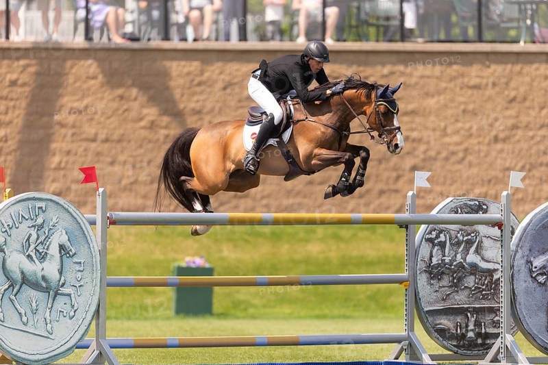Vaclav Stanek from Czechoslovakia, and riding Quintin, compete in the 1.60m Grand Prix during The Continental international competition at Spruce Meadows, in Calgary, Canada, North America