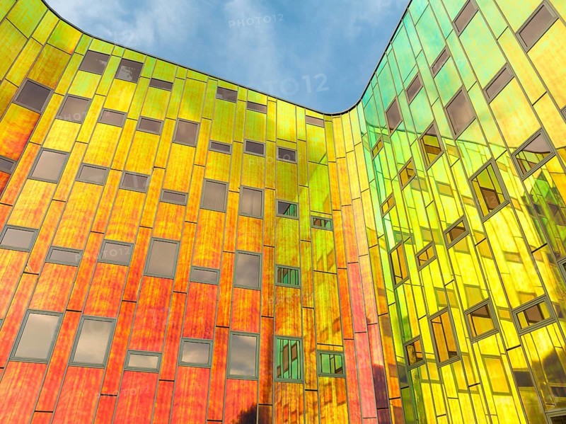 DEVENTER, NETHERLANDS, AUGUST 18, 2023: Colorful facade of a modern office building. The building is called L'Arc en Ciel, designed by L'M Architects
