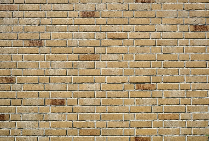 Background made from a wall of beige clinker bricks