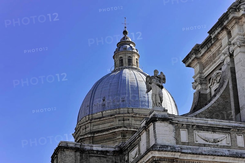 Basilica Santa Maria degli Angeli, Assisi, Umbria, Italy, Detail of an imposing dome with a statue in front of a clear blue sky, Assisi, Umbria, Italy, Europe