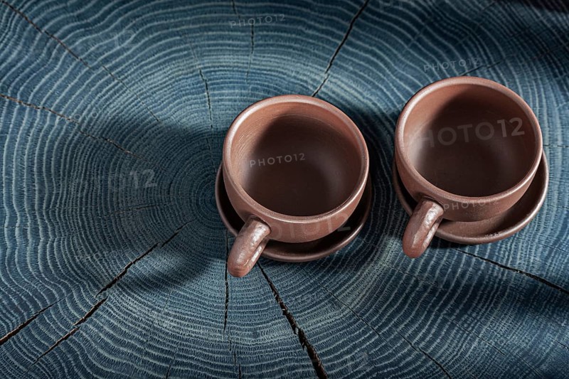 Two Empty Clay Coffee Cups On Wooden Background