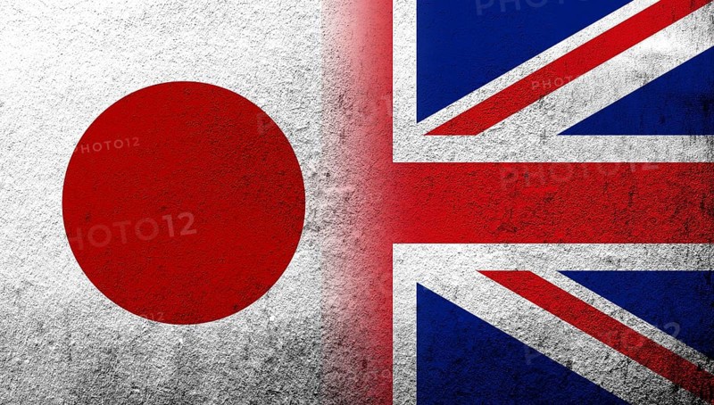 National flag of United Kingdom (Great Britain) Union Jack with National flag of Japan. Grunge background