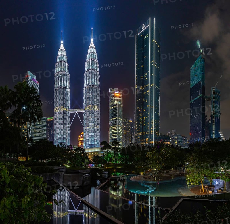 A picture of the Petronas Twin Towers as seen from the KLCC Park at night