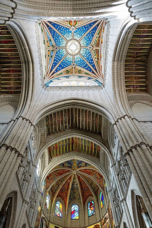 Almudena Cathedral: Iconic seat of Madrid's Archdiocese, built over a century, consecrated in 1993, adjacent to the Royal Palace