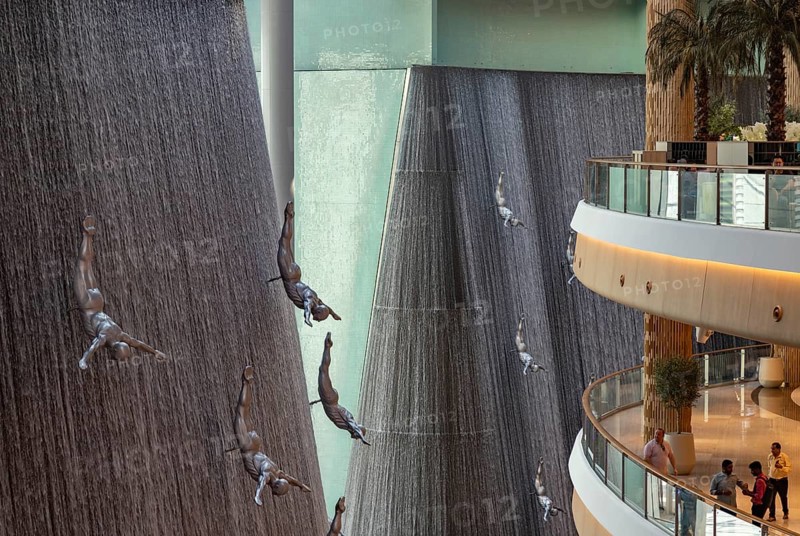 A picture of the Dubai Mall waterfalls and sculptures that decorate one of the many atriums of the large shopping center