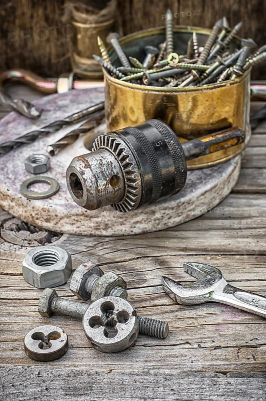 Set of old tools of the keys, screws and drills Selective focus