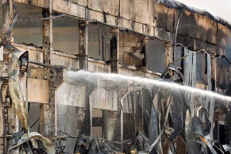 Fire disaster in a warehouse. Fire fighting in an industrial area