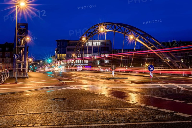 Luitpoldbrücke, Bamberg, Willy-Lessing-Straße, blue hour, city bridge at night with light traces of cars and modern buildings in the background the bridge pharmacy