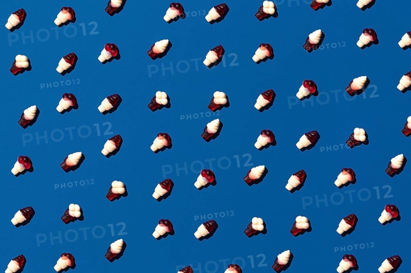 Flat lay photo tasty concept, minimal Sweet Candy jelly bean Colorful pattern on blue pastel background