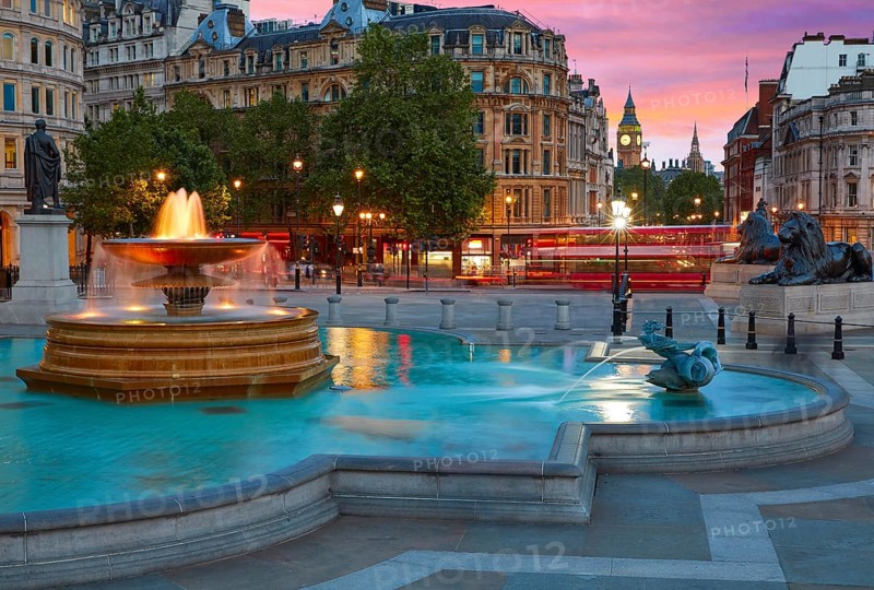 London Trafalgar Square fountain at sunset England