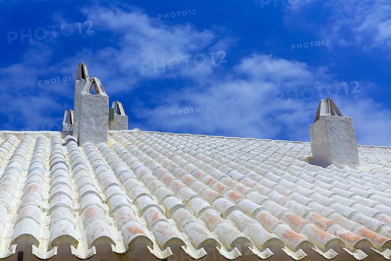 Binibequer Vell in Menorca White roof chimney Sant Lluis at Balearic Islands
