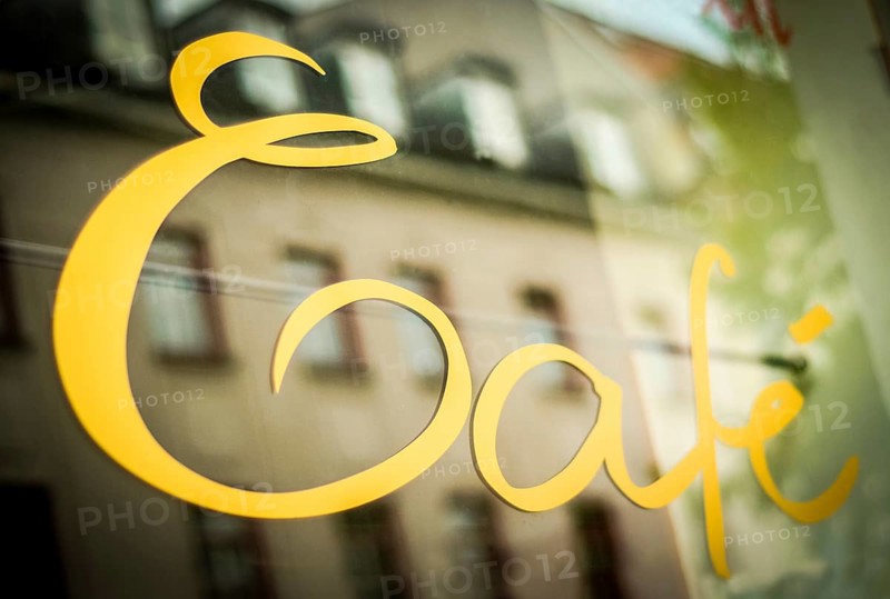Sign In The Window Of A Urban Cafe