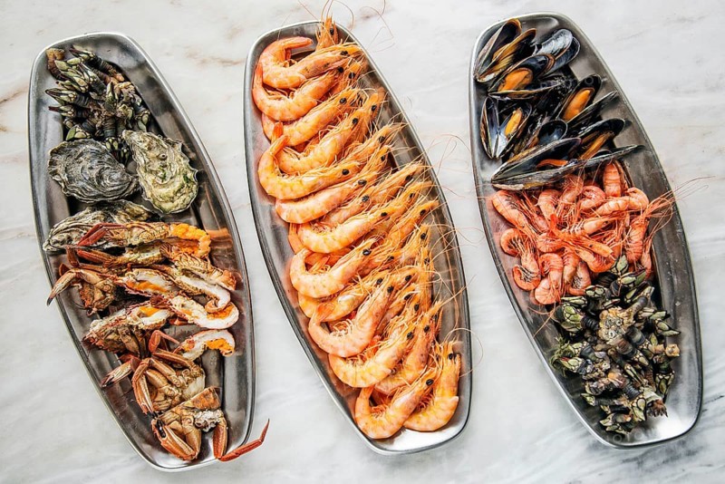 Mixed fresh portuguese seafood selection gourmet set platter meal on table