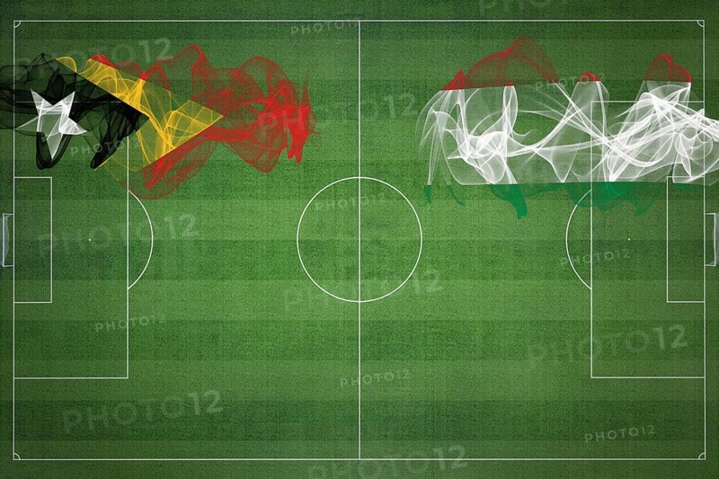 East Timor vs Hungary Soccer Match, national colors, national flags, soccer field, football game, Competition concept, Copy space
