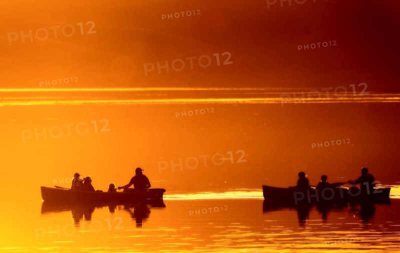 Sunset Sillouette Canoe orange color Saskatchewan Canada