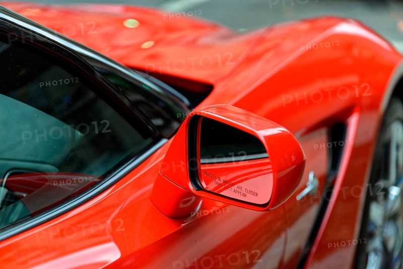 Red Corvette, Manhattan, New York City, New York, USA, North America, Red car with close focus on side rear view mirror on shiny surface, North America