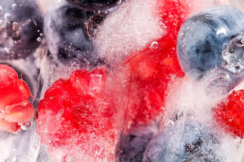 Raspberry and blackberry frozen in ice sticks, POLAND