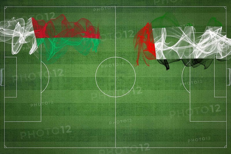 Madagascar vs United Arab Emirates Soccer Match, national colors, national flags, soccer field, football game, Competition concept, Copy space