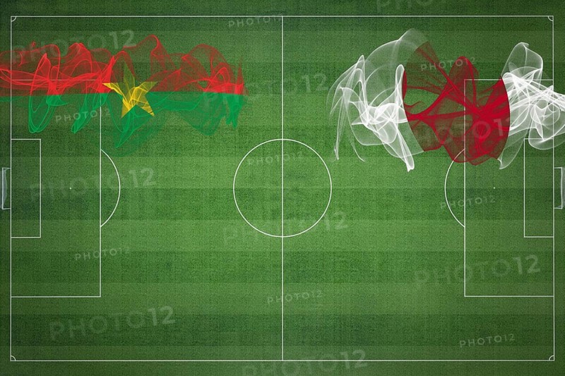 Burkina Faso vs Japan Soccer Match, national colors, national flags, soccer field, football game, Competition concept, Copy space