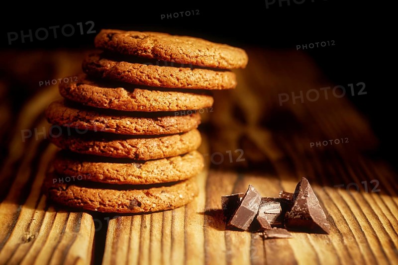 Chocolate chip cookies and cookies with oat flakes or oatmeal on the old wooden table