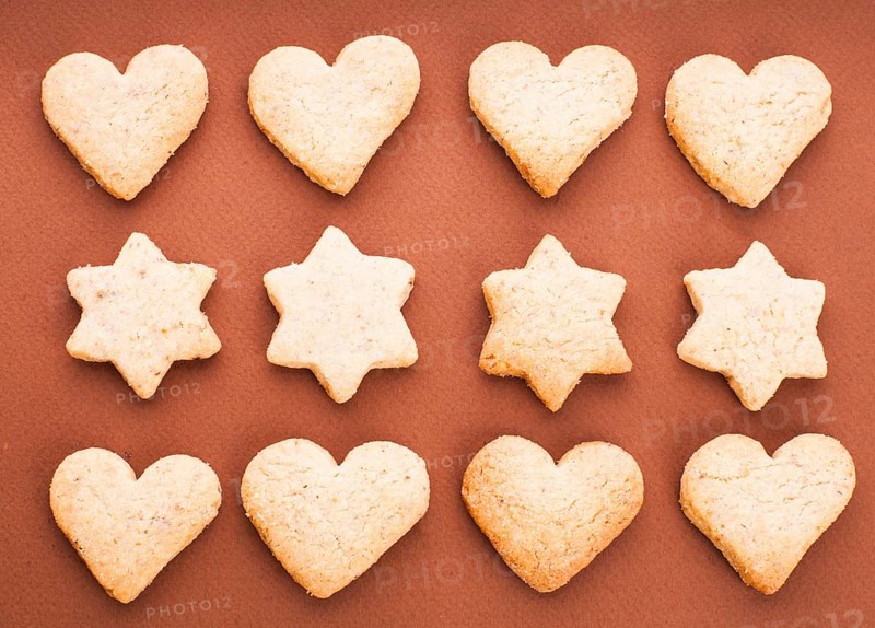 Holiday cookies as a background pattern on brown