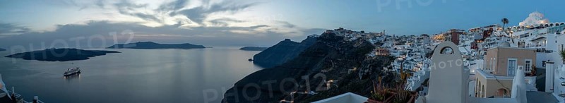 Cruise ship in the archipelago of Santorini, evening mood after sunset, white buildings at the edge of the crater, blue hour, panoramic shot, Fira, island of Santorini, Cyclades, Greece, Cyclades, Greece, Europe